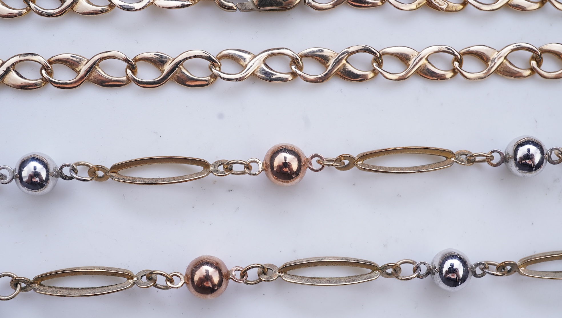 Three gold necklaces